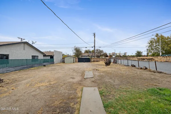 a view of a house with a road