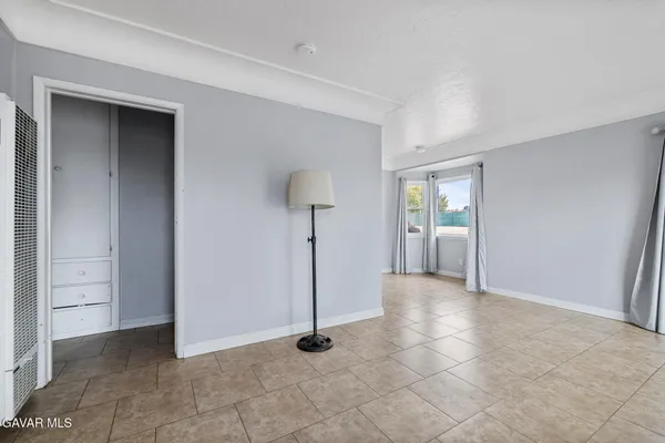 an empty room with entrance and door