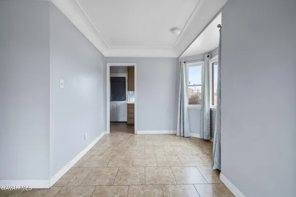 a view of hallway with bathroom