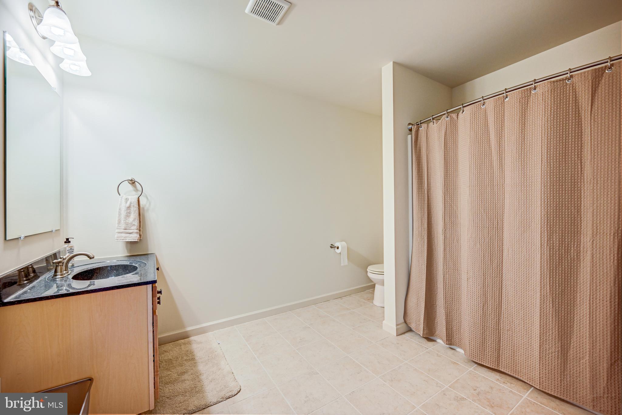 3265 Lewisberry Road York, PA 17404 - Photo 26 of 34 a bathroom with a granite countertop sink and a mirror