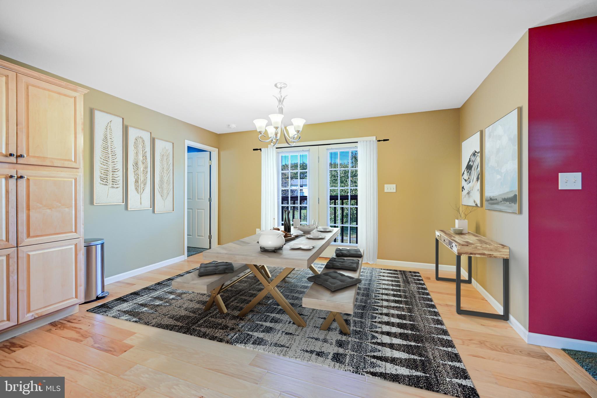 3265 Lewisberry Road York, PA 17404 - Photo 4 of 34 a living room with furniture and a chandelier