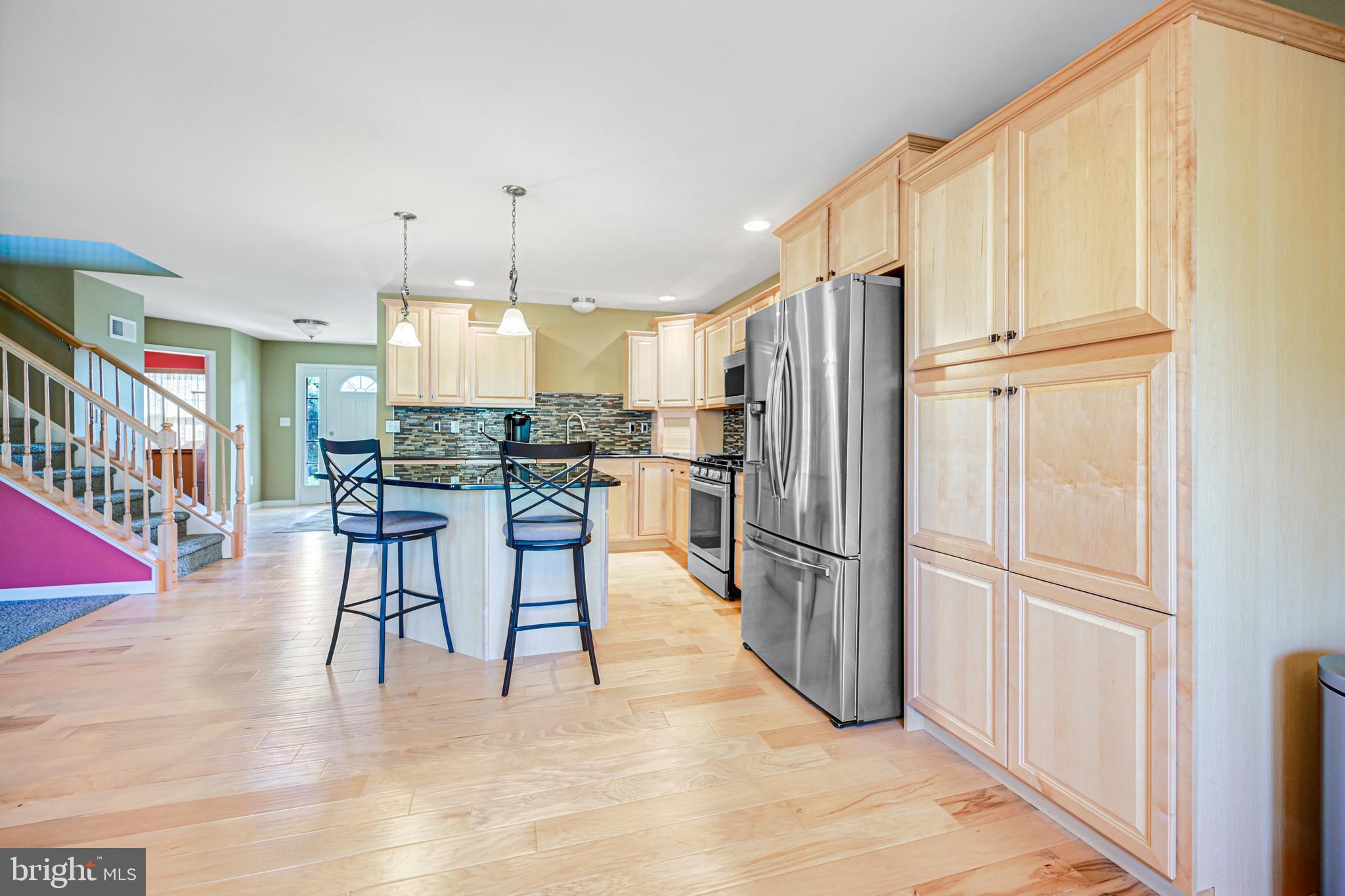 3265 Lewisberry Road York, PA 17404 - Photo 6 of 34 a kitchen with stainless steel appliances granite countertop a refrigerator and a stove top oven
