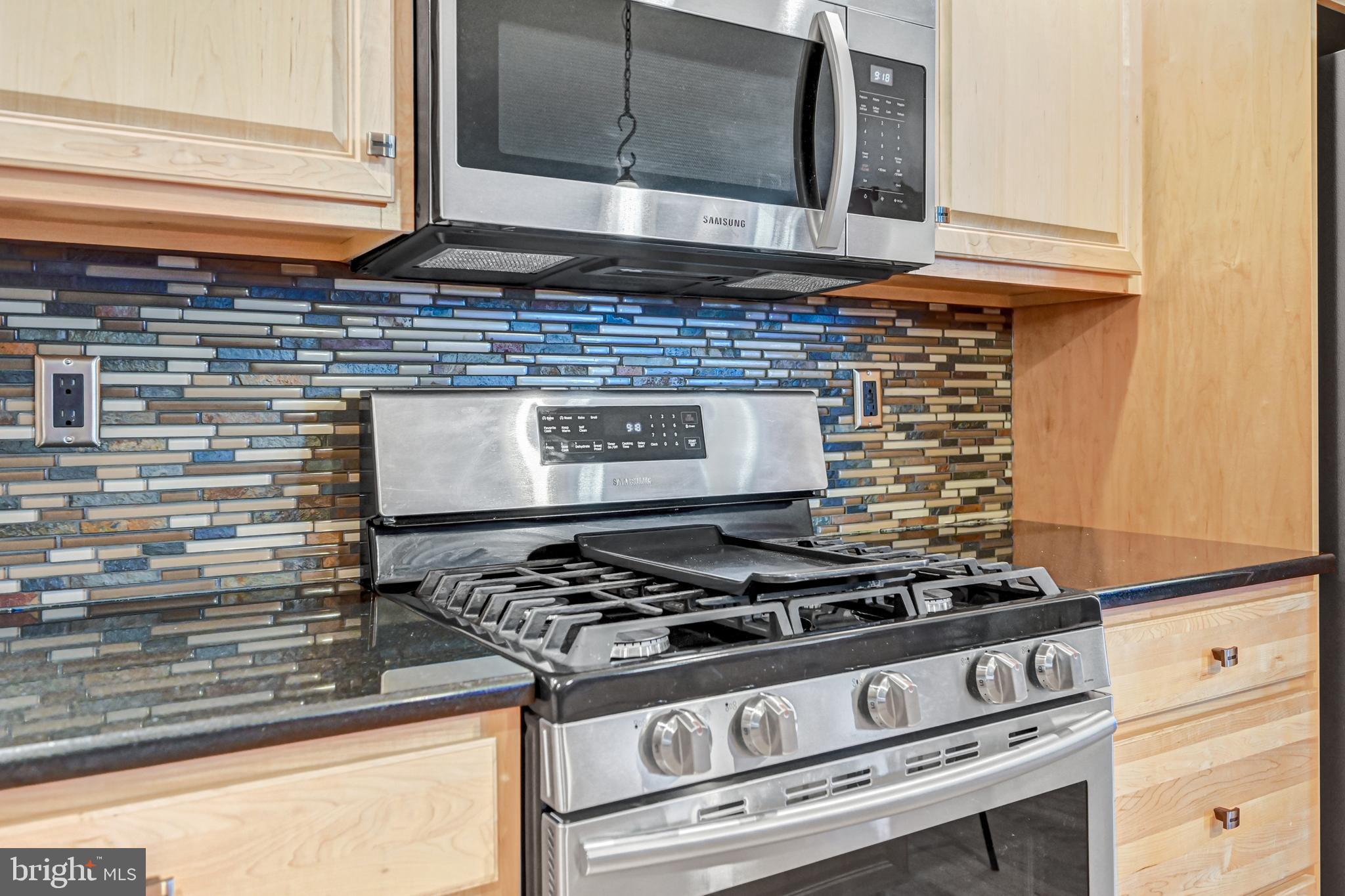 3265 Lewisberry Road York, PA 17404 - Photo 9 of 34 a stove top oven sitting inside of a kitchen