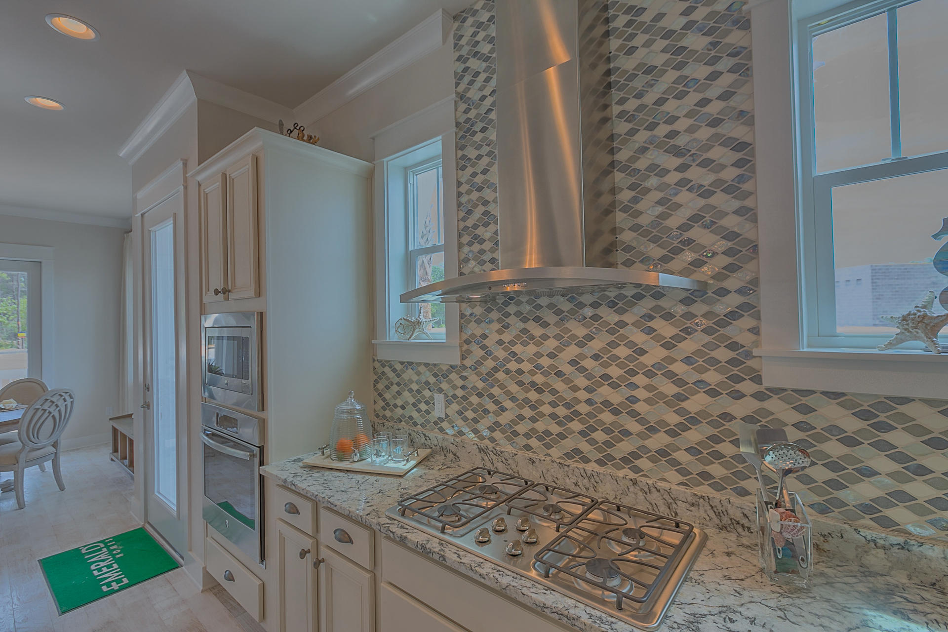 336 Milestone Dr Inlet Beach, Unit 534B Inlet Beach, FL 32461 - Photo 12 of 50 a bathroom with a granite countertop sink a mirror and shower