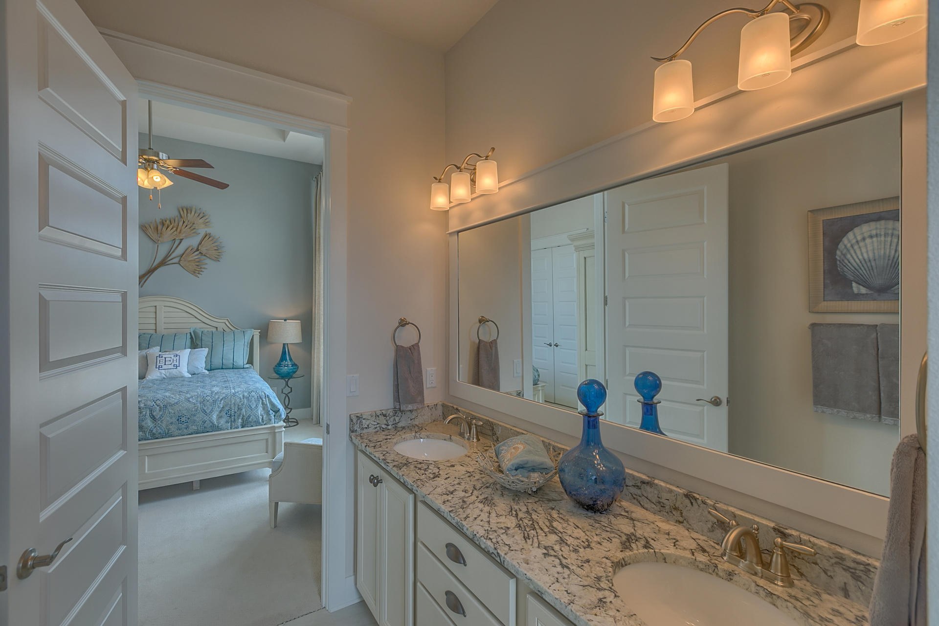 336 Milestone Dr Inlet Beach, Unit 534B Inlet Beach, FL 32461 - Photo 23 of 50 a bathroom with sinks granite countertop a sink and a mirror