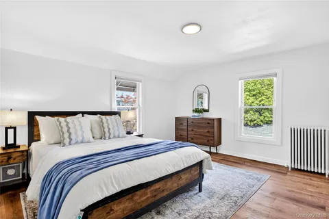 a bed room with a bed and a window
