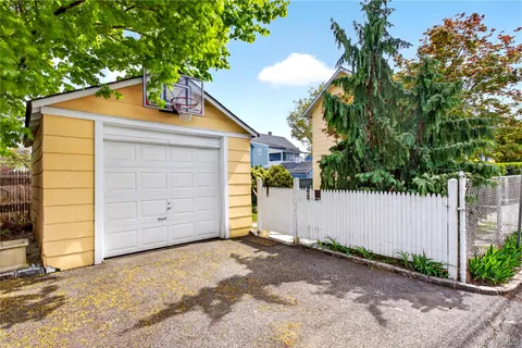 a house that has a tree in front of it