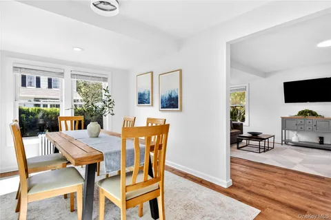 a view of a dining room with furniture and a livingroom