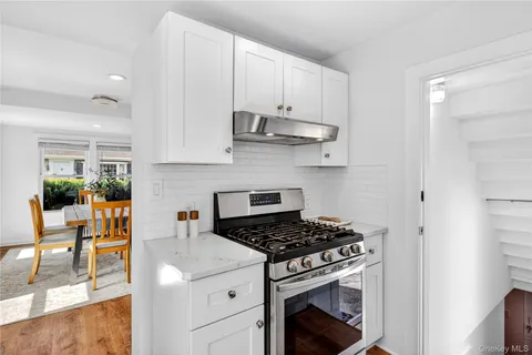 a kitchen with cabinets and appliances