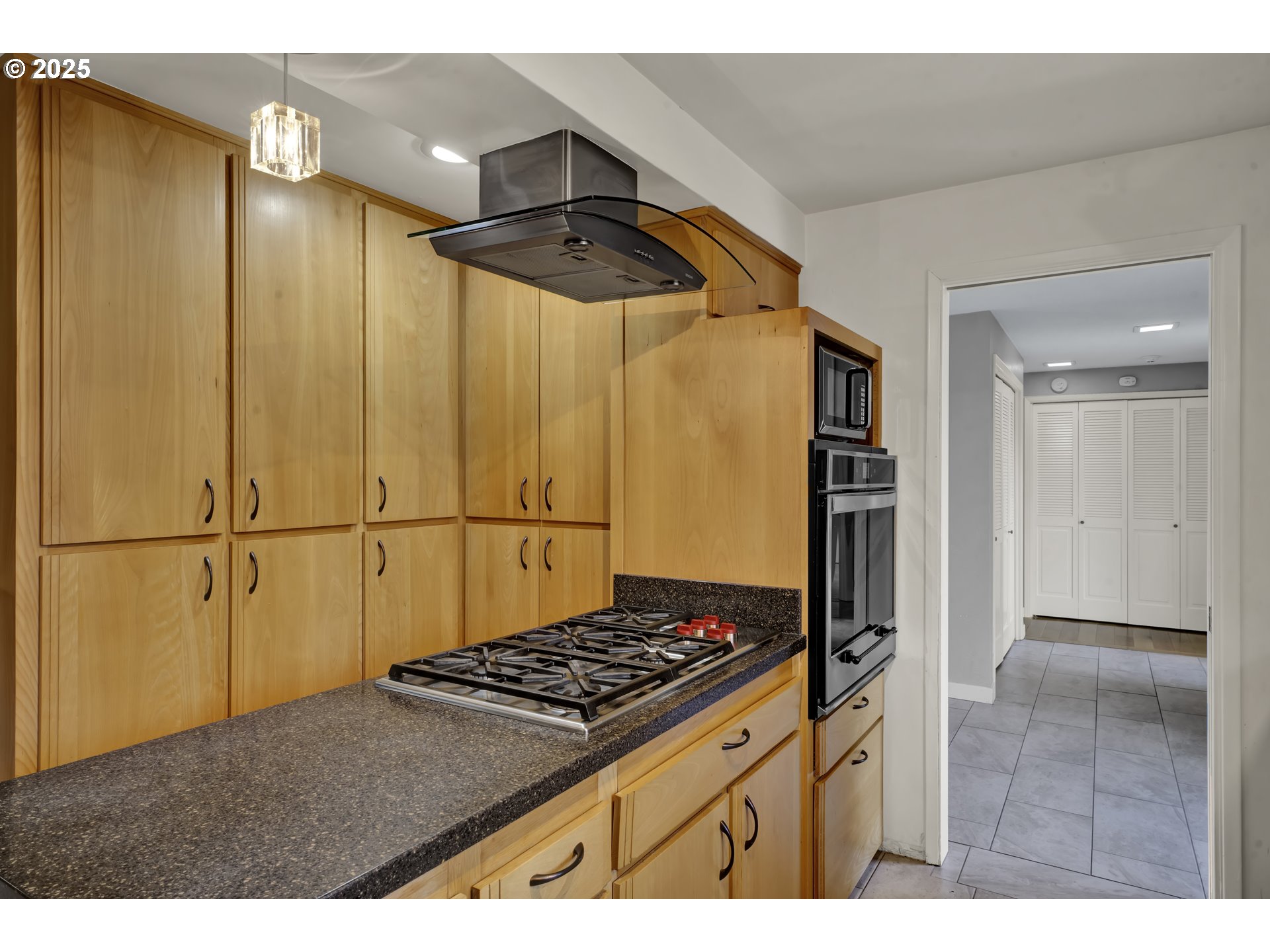 2140 Tabor Street Eugene, OR 97401 - Photo 11 of 26 a kitchen with stainless steel appliances granite countertop a refrigerator and a sink