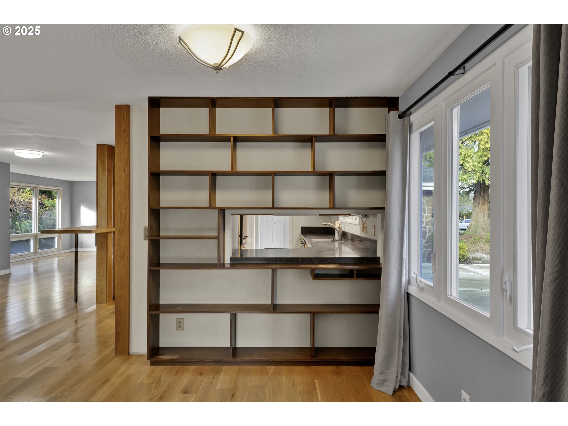 2140 Tabor Street Eugene, OR 97401 - Photo 12 of 26 a view of a room that has a window and wooden floor