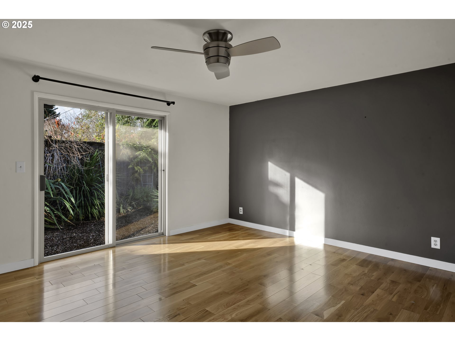 2140 Tabor Street Eugene, OR 97401 - Photo 13 of 26 a view of an empty room with wooden floor and a window
