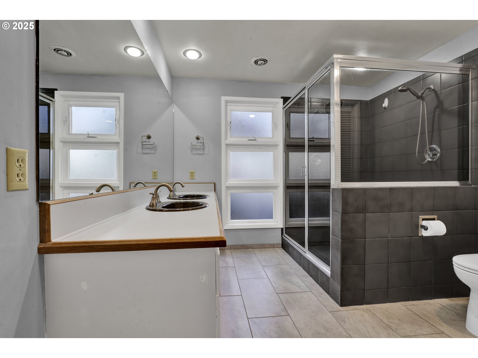 2140 Tabor Street Eugene, OR 97401 - Photo 19 of 26 a bathroom with a sink shower and a mirror