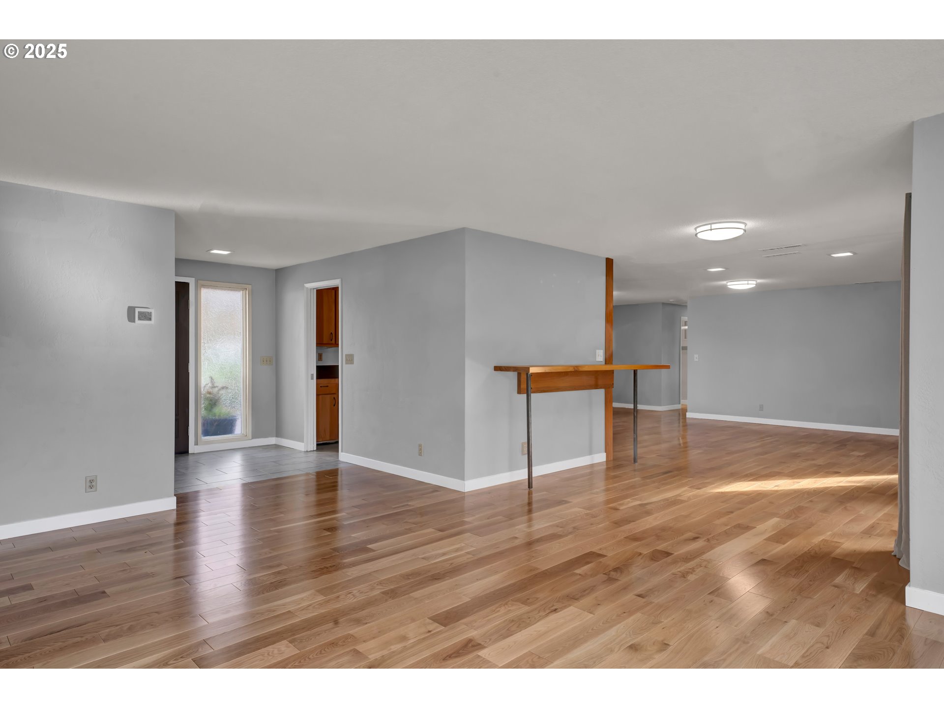 2140 Tabor Street Eugene, OR 97401 - Photo 5 of 26 a view of an empty room with wooden floor