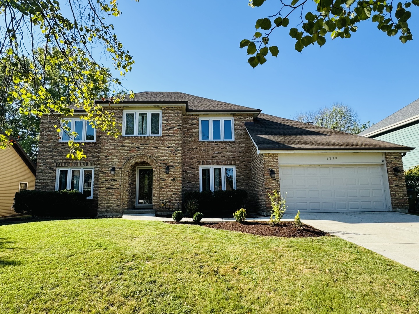 1398 East Gartner Road Naperville, IL 60540 - Photo 1 of 31 a front view of a house with a yard