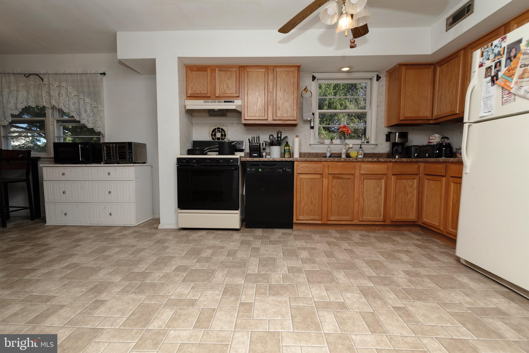 30 Timberline Drive Newark, DE 19711 - Photo 11 of 39 a kitchen with stainless steel appliances granite countertop a stove a sink a refrigerator and a granite counter tops