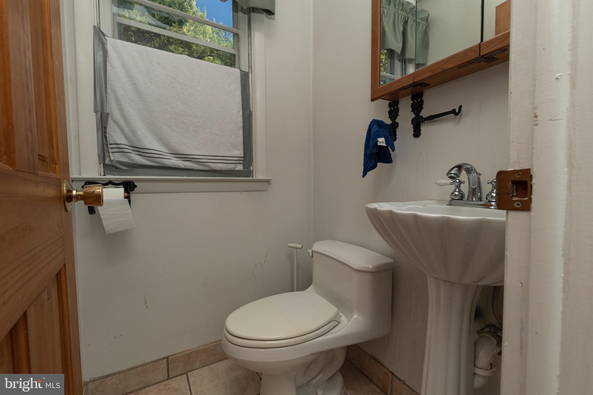 30 Timberline Drive Newark, DE 19711 - Photo 16 of 39 a bathroom with a toilet sink and mirror