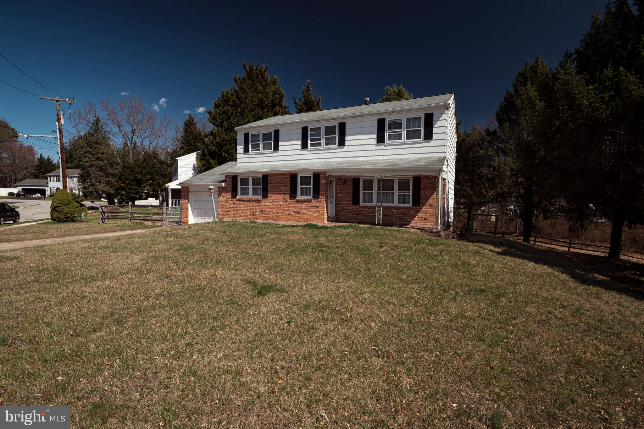 30 Timberline Drive Newark, DE 19711 - Photo 2 of 39 a front view of a house with a yard and garage