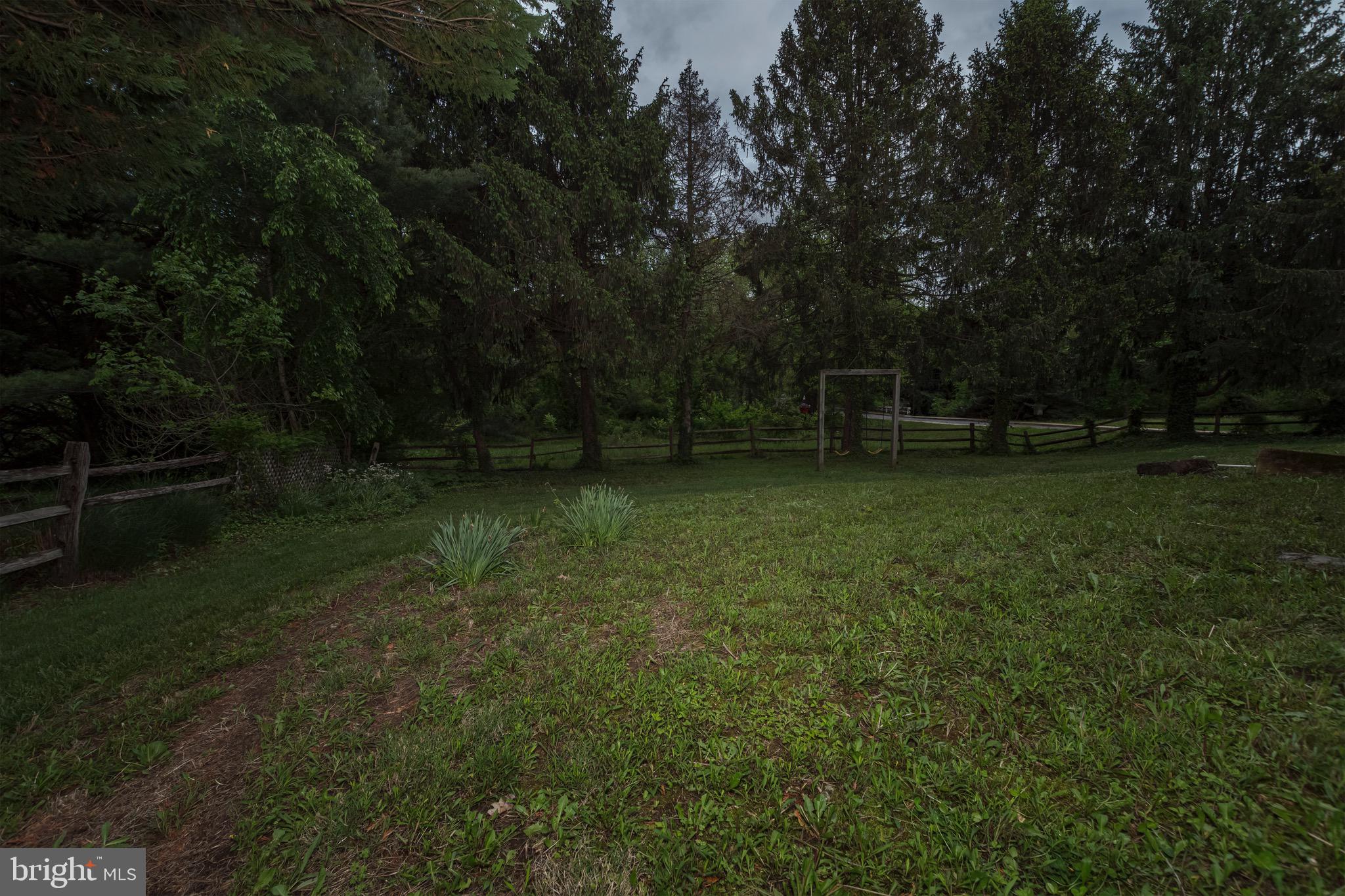 30 Timberline Drive Newark, DE 19711 - Photo 28 of 39 a backyard of a house with lots of green space and garden