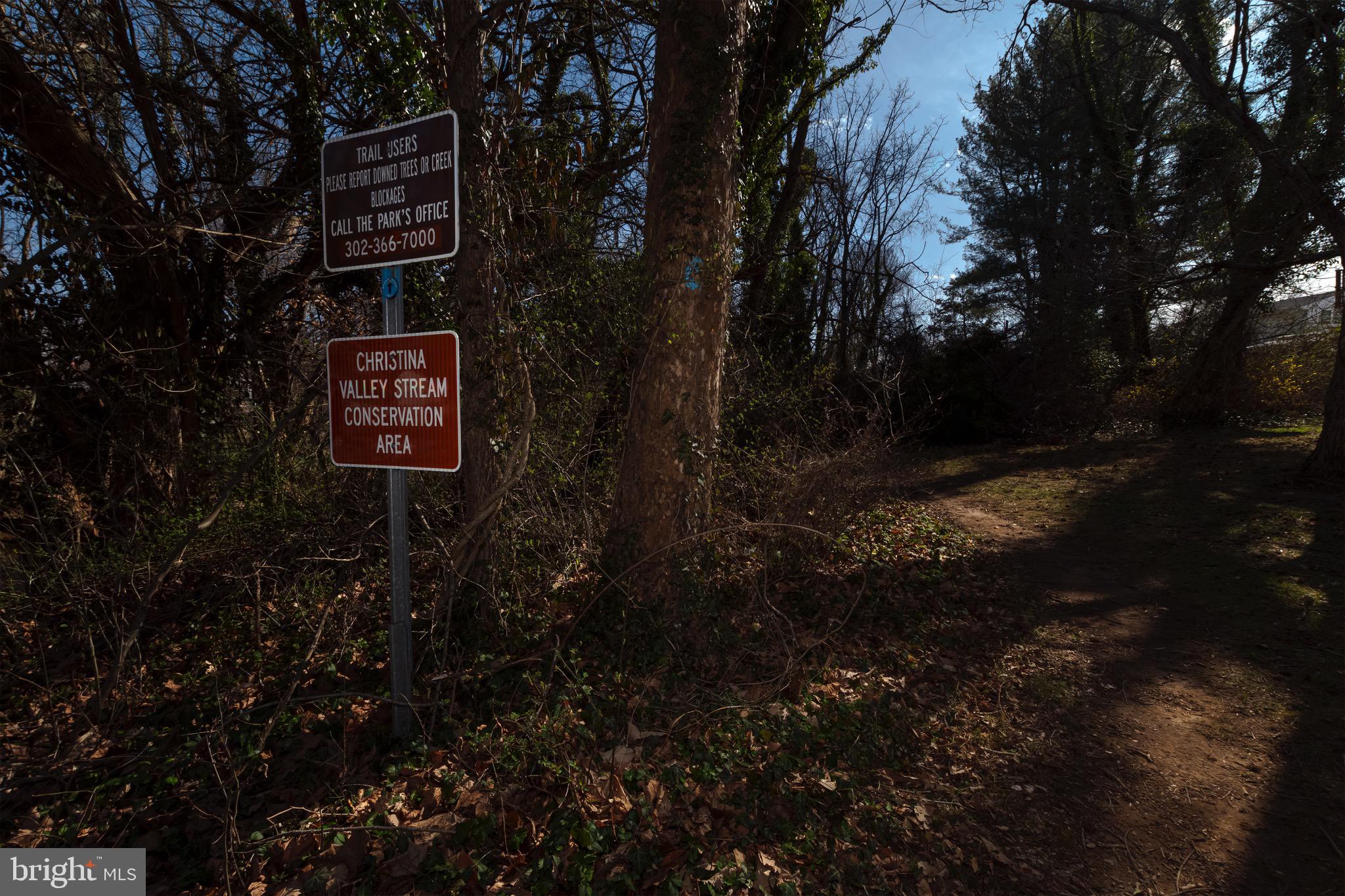 30 Timberline Drive Newark, DE 19711 - Photo 29 of 39 a sign that is sitting in the middle of forest