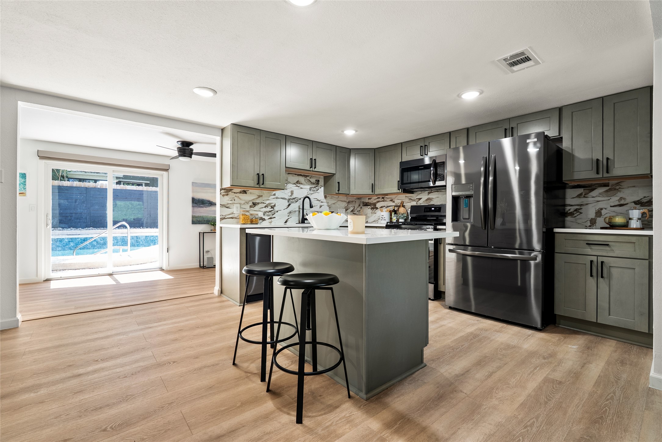 507 West Dittmar Road Austin, TX 78745 - Photo 12 of 40 a kitchen with stainless steel appliances a stove a sink refrigerator and cabinets