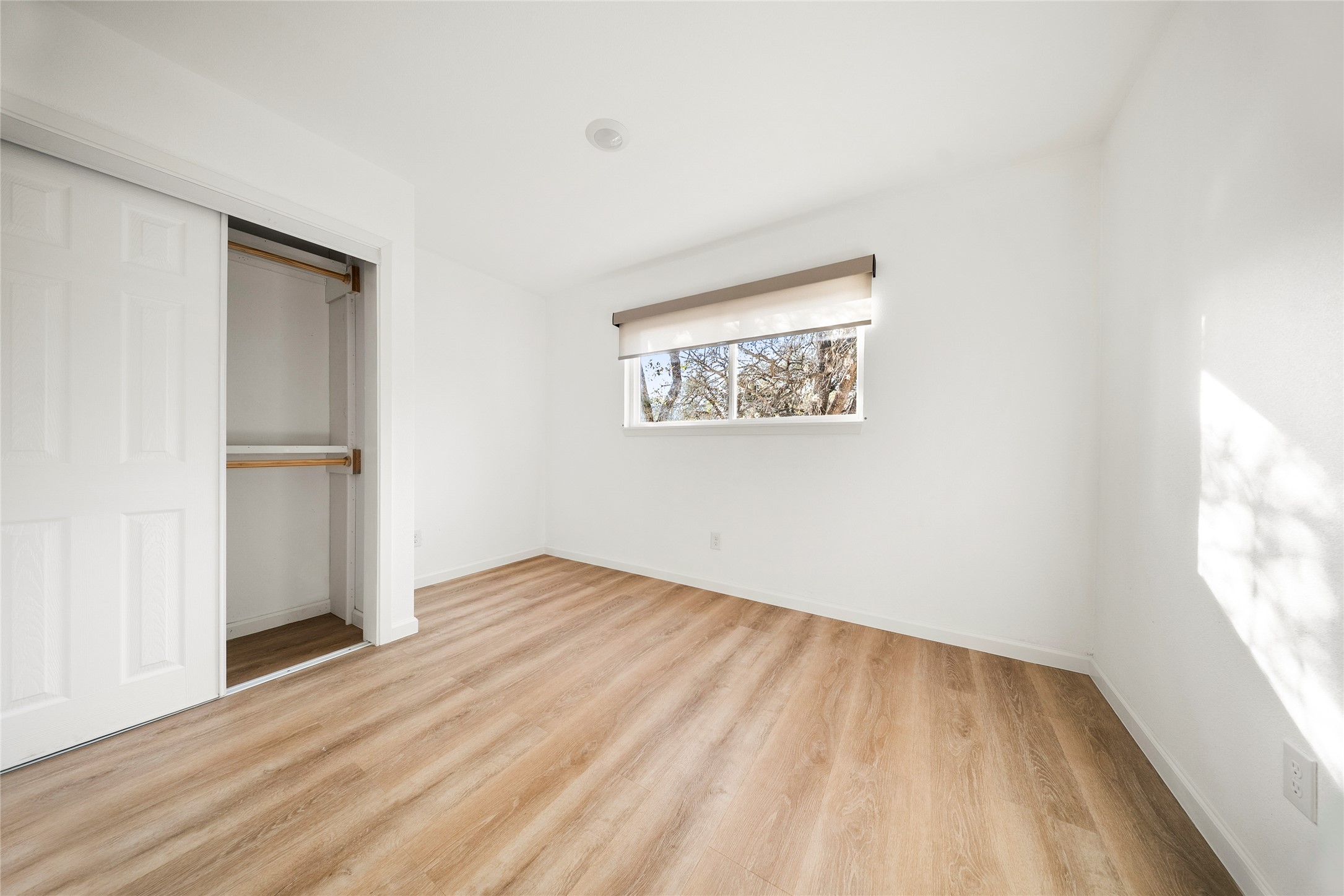 507 West Dittmar Road Austin, TX 78745 - Photo 22 of 40 an empty room with wooden floor and windows