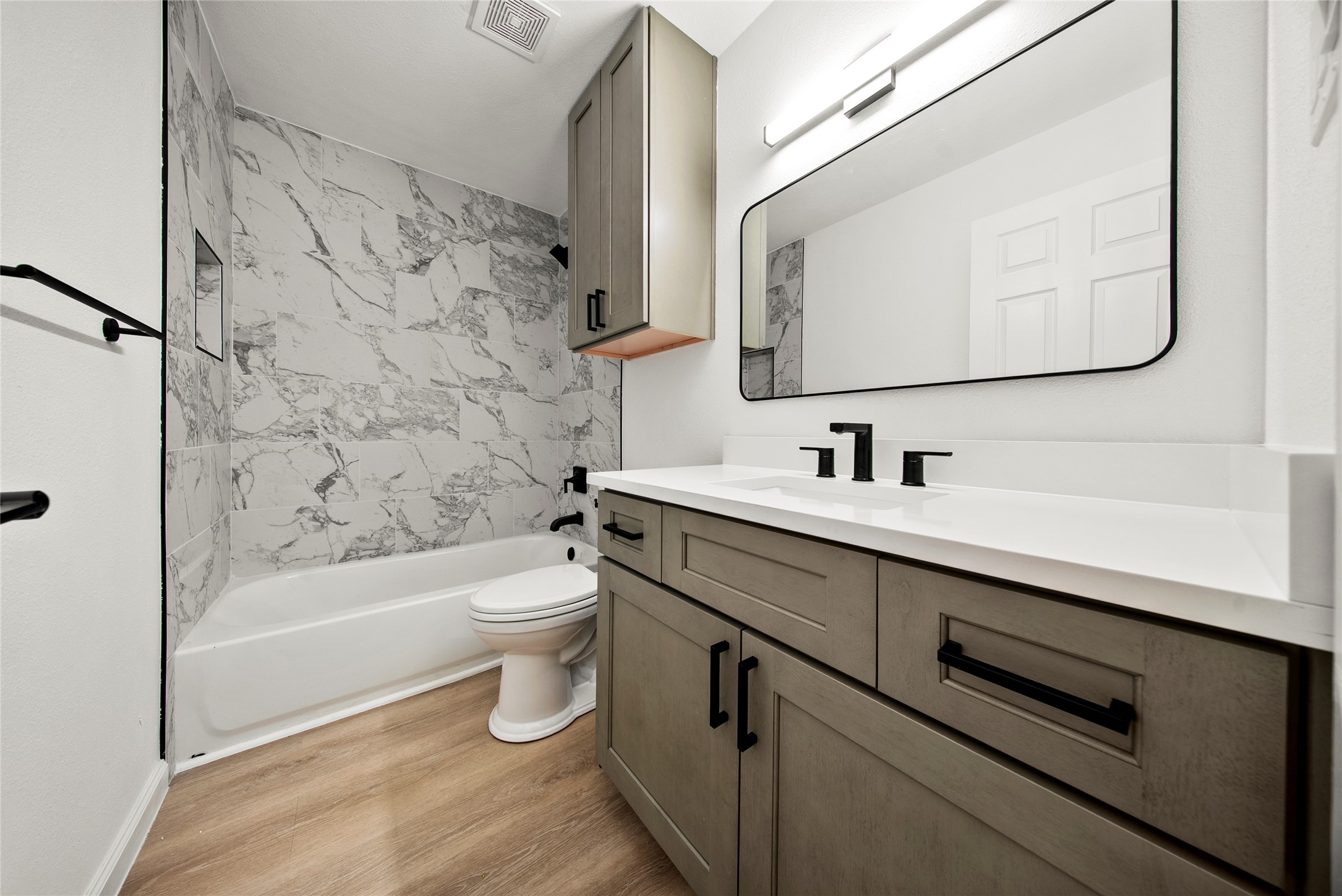 507 West Dittmar Road Austin, TX 78745 - Photo 24 of 40 a bathroom with a bathtub sink mirror and toilet