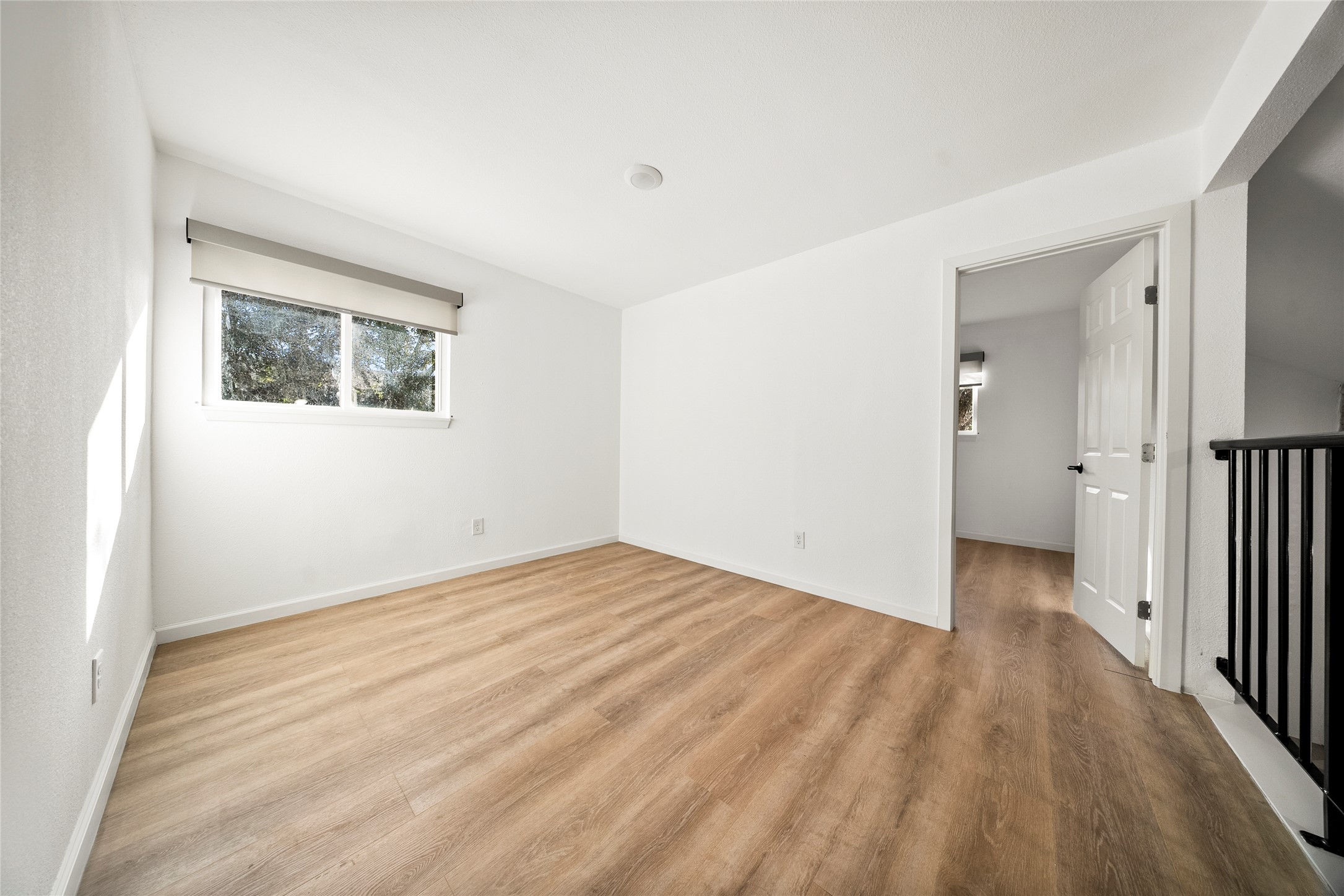 507 West Dittmar Road Austin, TX 78745 - Photo 26 of 40 a view of a room with wooden floor and a hallway