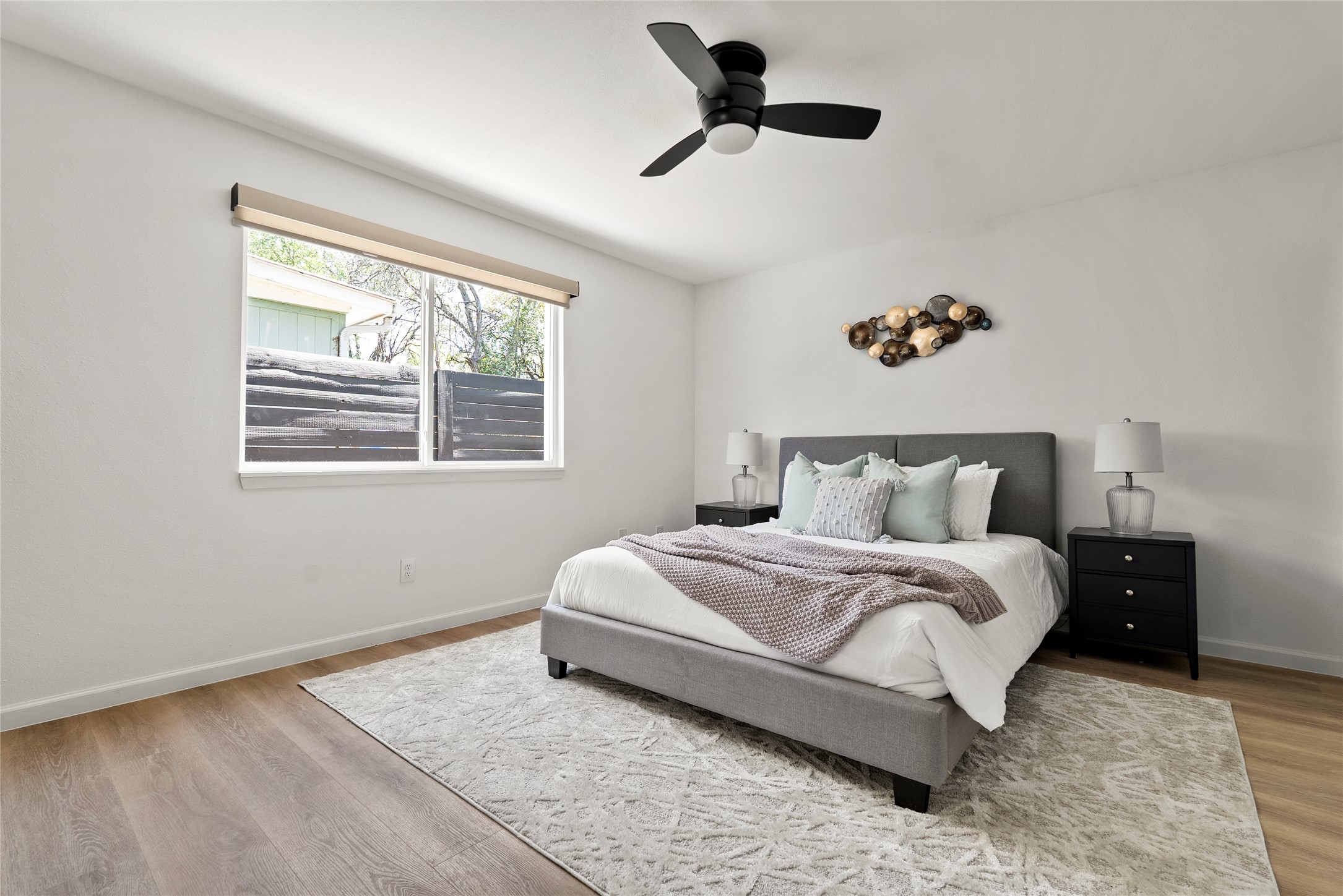 507 West Dittmar Road Austin, TX 78745 - Photo 7 of 40 a spacious bedroom with a bed and a window