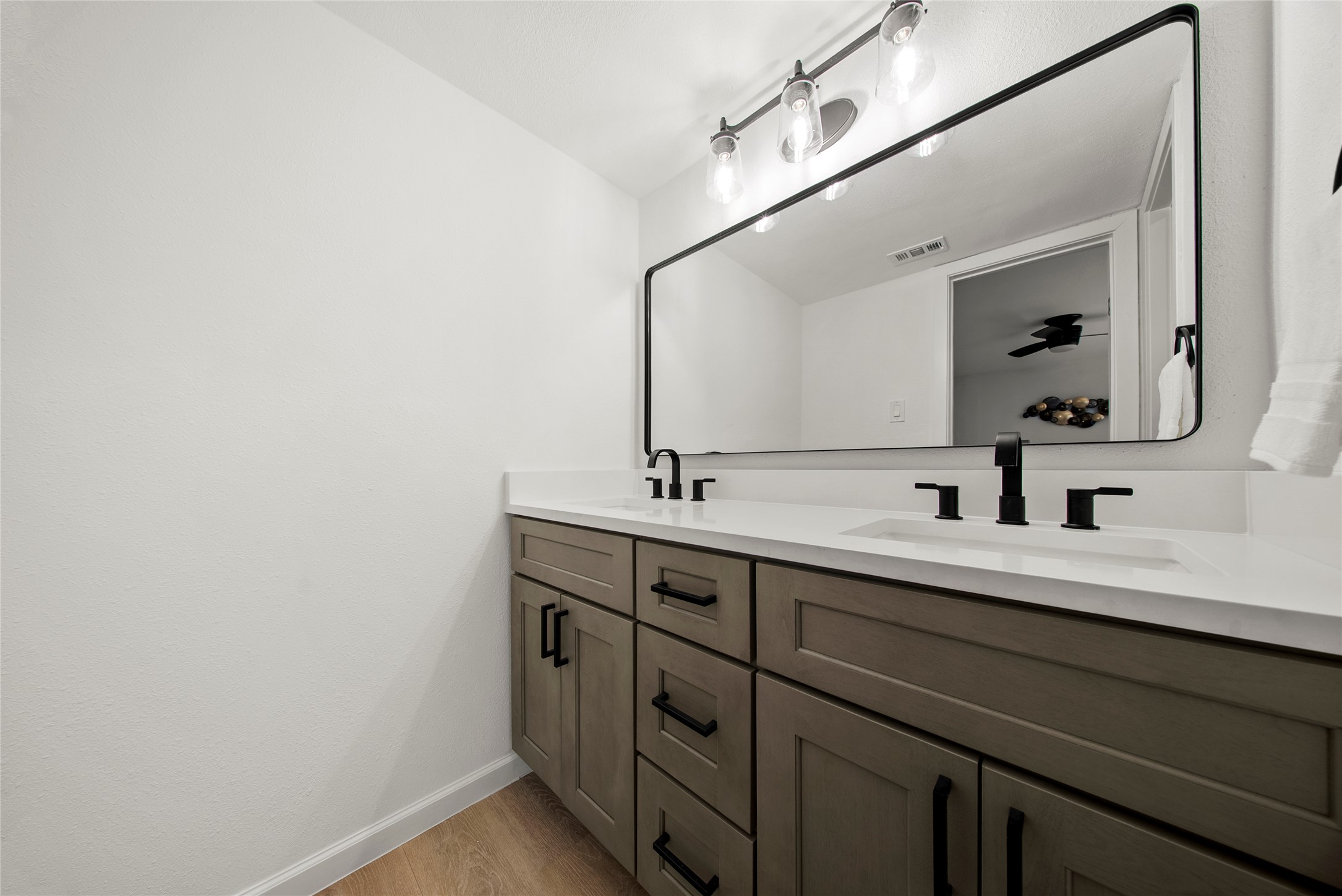 507 West Dittmar Road Austin, TX 78745 - Photo 10 of 40 a bathroom with a double vanity sink and mirror