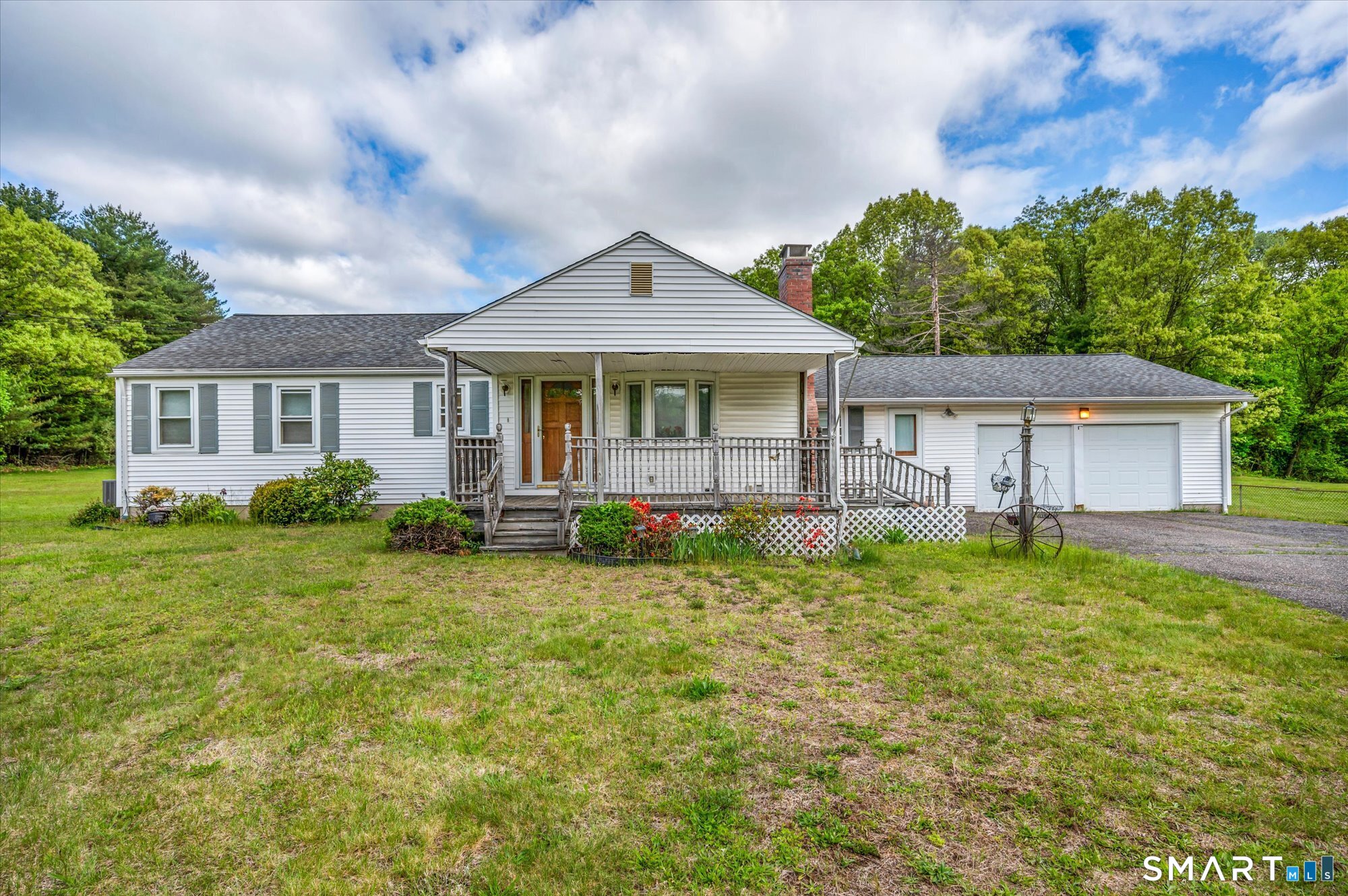740 Rainbow Road Windsor, CT 06095 - Photo 1 of 40 a front view of a house with a yard