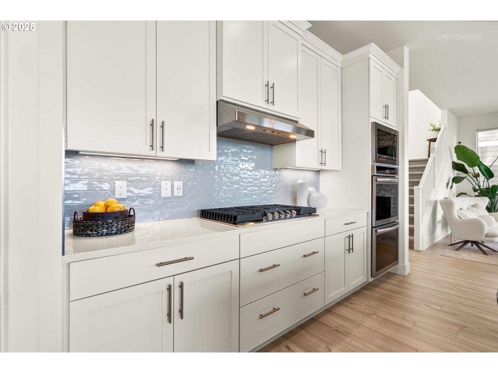 12305 Southwest Silvertip Street Beaverton, OR 97007 - Photo 14 of 43 a kitchen with stainless steel appliances granite countertop a sink a stove a refrigerator and white cabinets