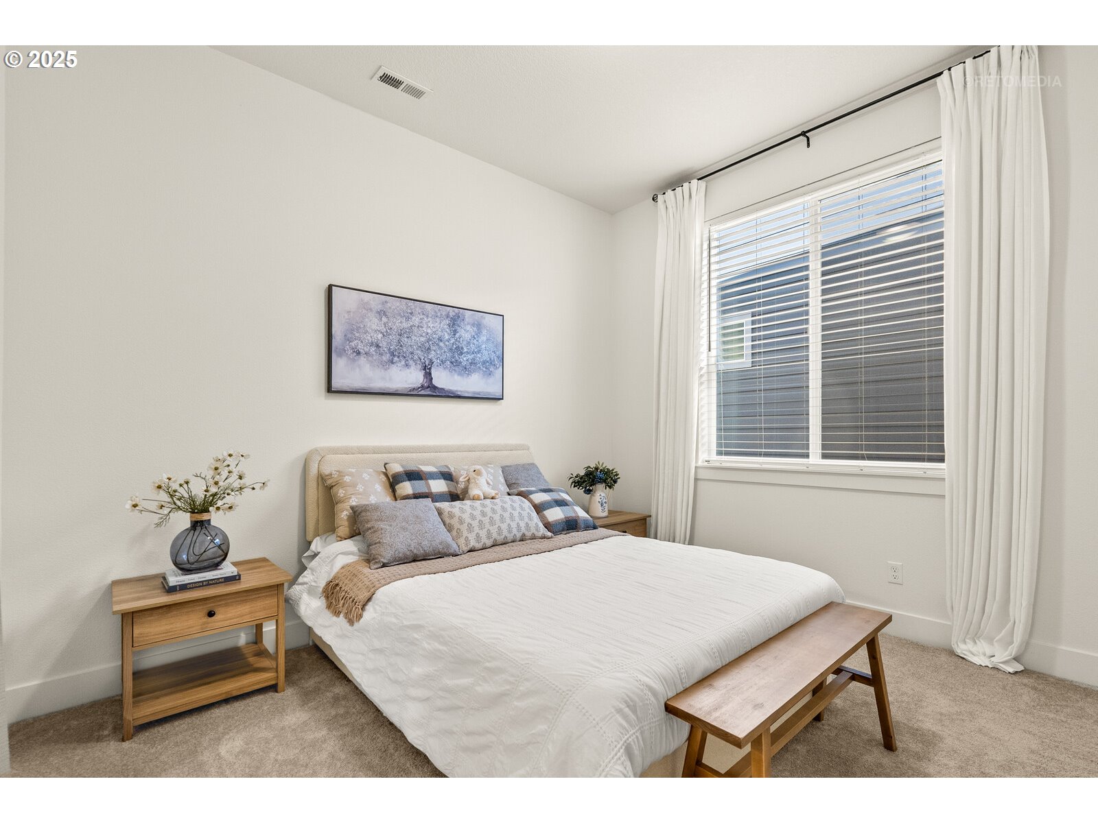 12305 Southwest Silvertip Street Beaverton, OR 97007 - Photo 22 of 43 a bedroom with a bed and wooden floor