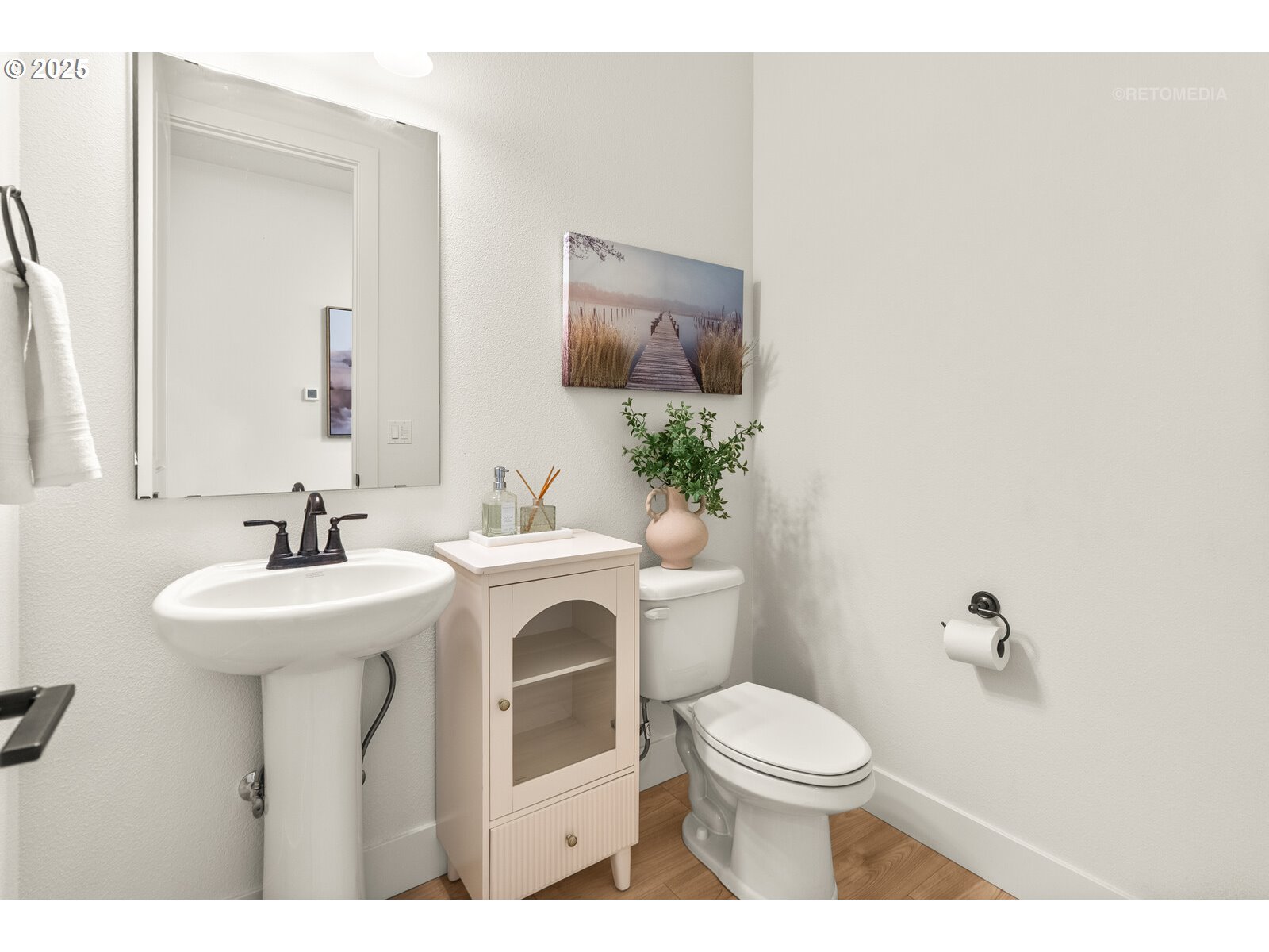 12305 Southwest Silvertip Street Beaverton, OR 97007 - Photo 24 of 43 a bathroom with a sink toilet and a mirror