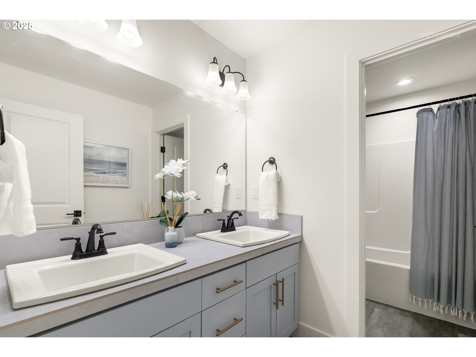 12305 Southwest Silvertip Street Beaverton, OR 97007 - Photo 31 of 43 a bathroom with a sink and a mirror