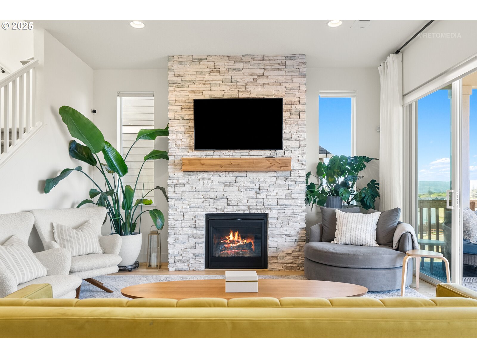12305 Southwest Silvertip Street Beaverton, OR 97007 - Photo 6 of 43 a living room with furniture a flat screen tv and a fireplace