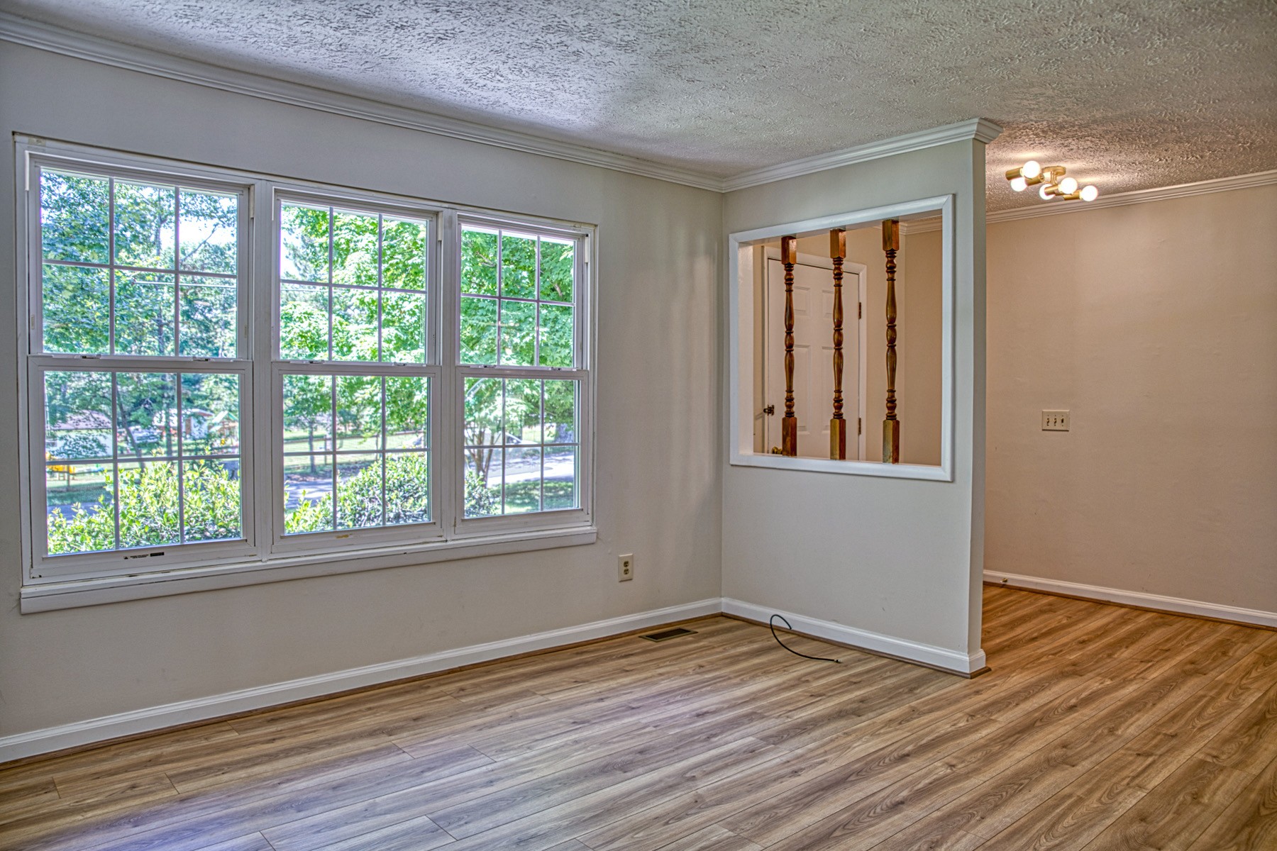 2085 Herbert Garrett Road Cookeville, TN 38506 - Photo 9 of 39 a view of empty room with wooden floor and fan