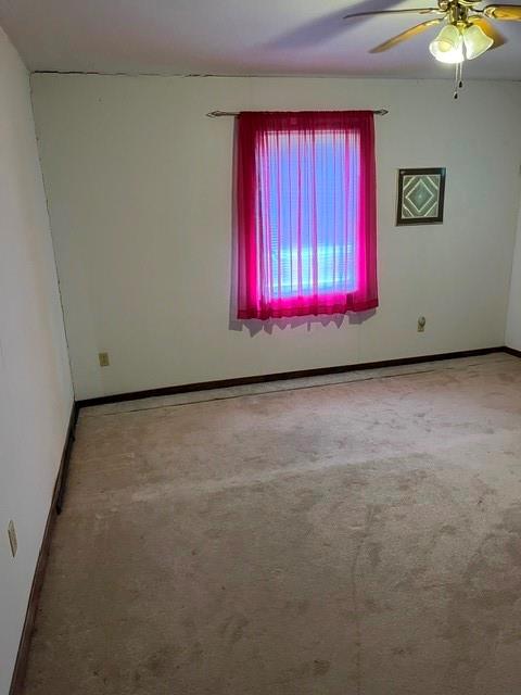 304 Sunset Street Roxton, TX 75477 - Photo 8 of 31 a room with red walls and a window