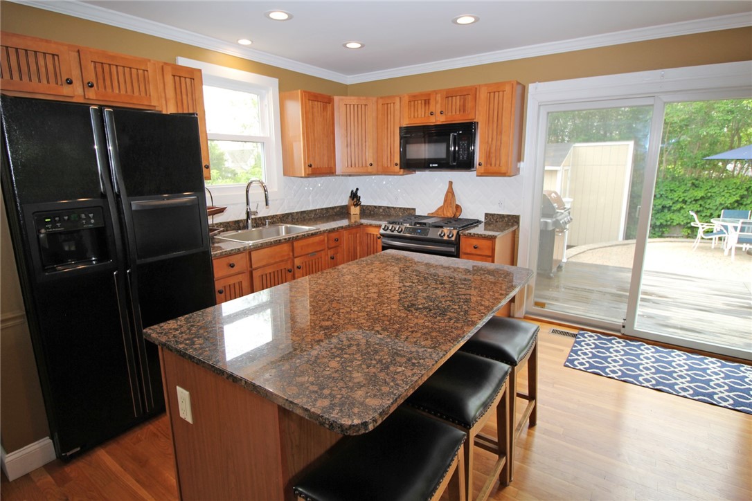 198 Reservoir Road Middletown, RI 02842 - Photo 11 of 50 Kitchen has large island counter providing nice extra workspace and room for casual dining,