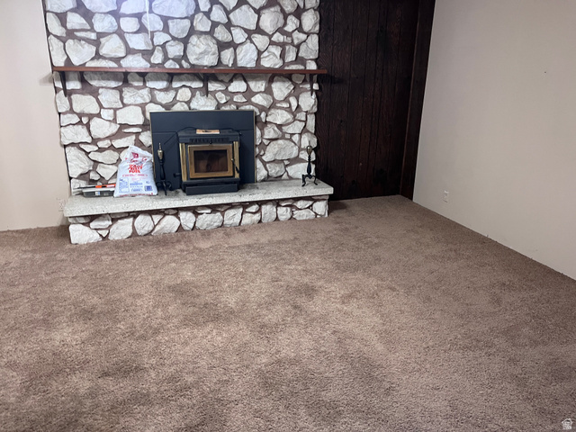 1766 Pine Rd Pine Canyon Tooele, UT 84074 - Photo 13 of 16 Stone-clad fireplace with a wood-burning insert and a stone hearth