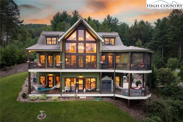 a living room with furniture fireplace and flat screen tv