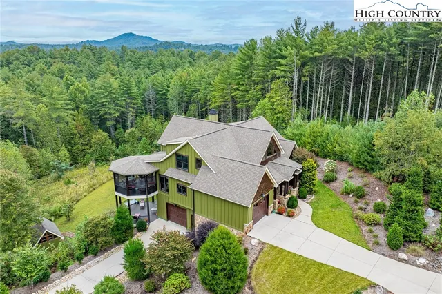 a view of a balcony with chair and wooden floor