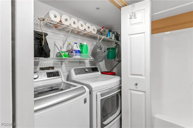 a utility room with dryer and washer