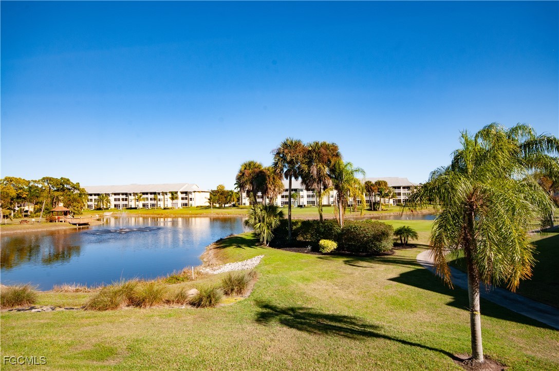 20121 Ian Court, Unit 209 Estero, FL 33928 - Photo 19 of 40 a view of a lake with houses