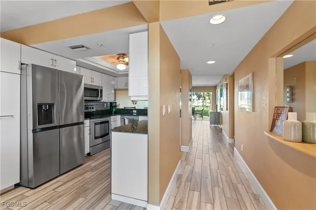 a view of a kitchen from the hallway