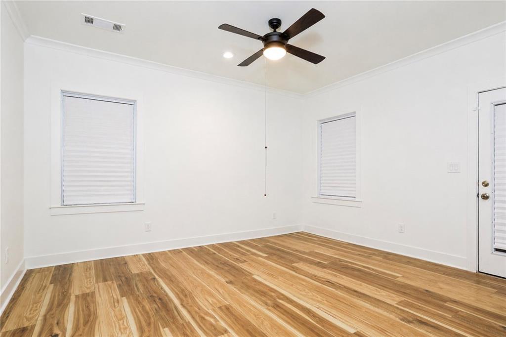 3040 Valley Circle Decatur, GA 30033 - Photo 14 of 19 a view of a room with wooden floor and a ceiling fan