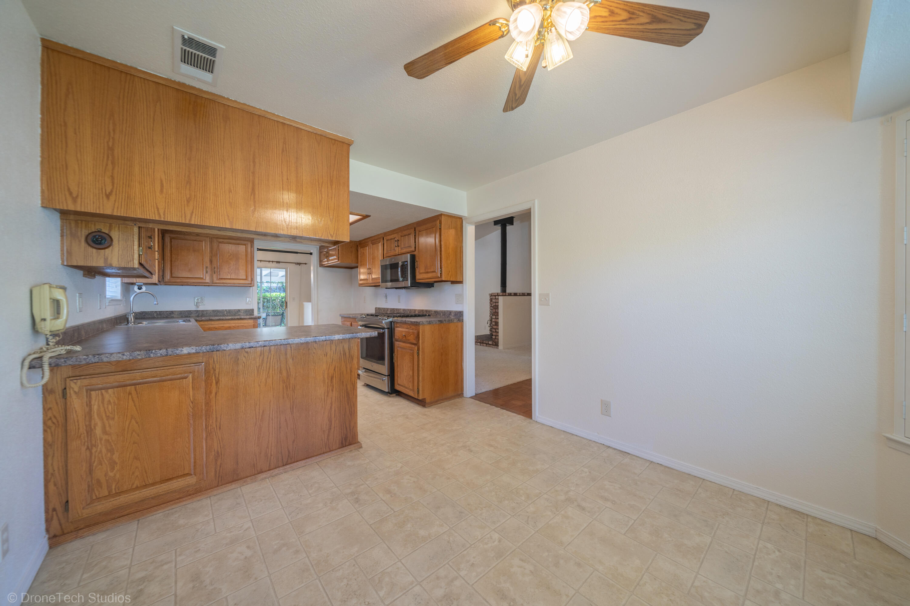 2227 Wicklow Street Redding, CA 96001 - Photo 17 of 90 a kitchen with cabinets and a stove top oven