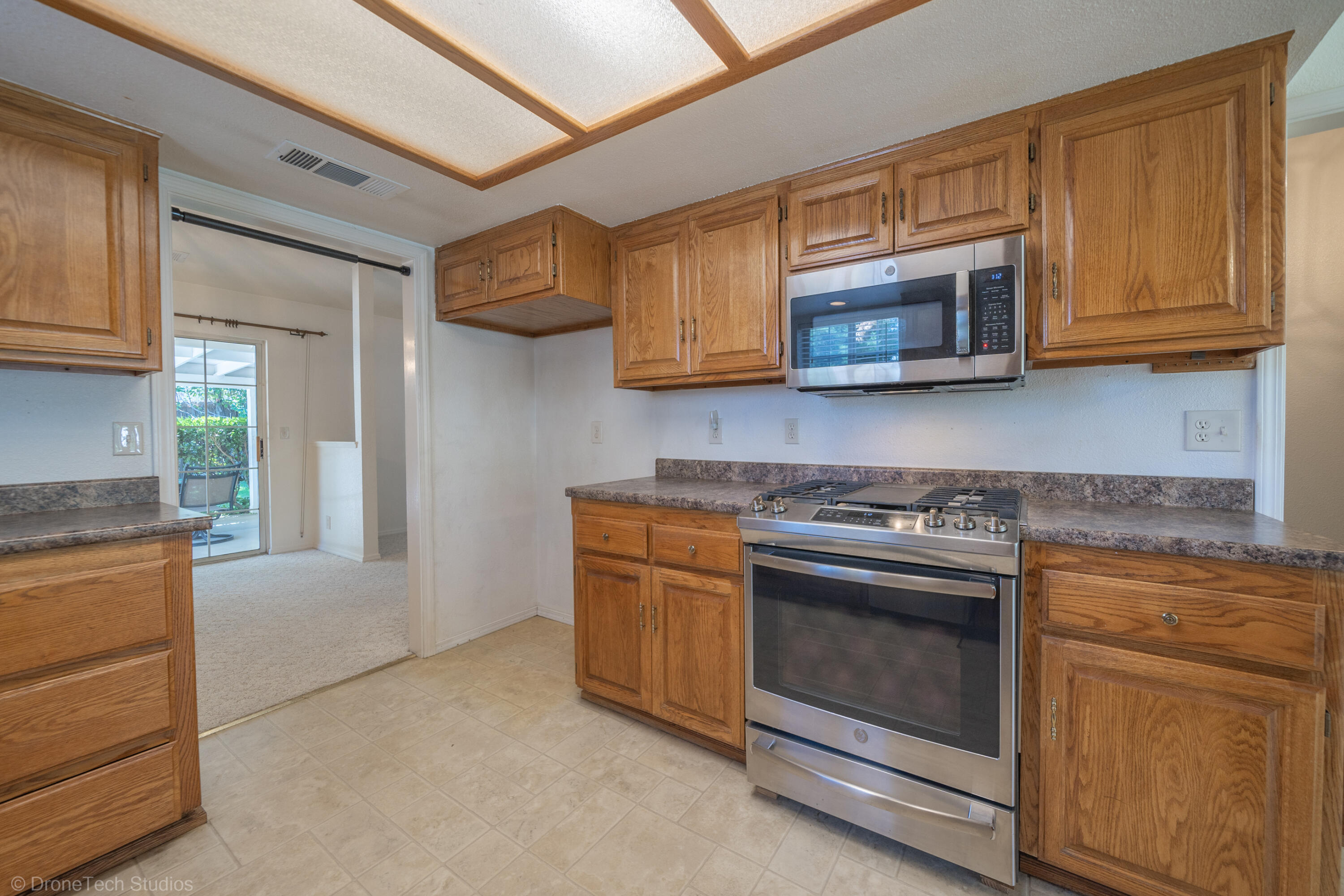 2227 Wicklow Street Redding, CA 96001 - Photo 22 of 90 a kitchen with stainless steel appliances granite countertop a stove and a sink