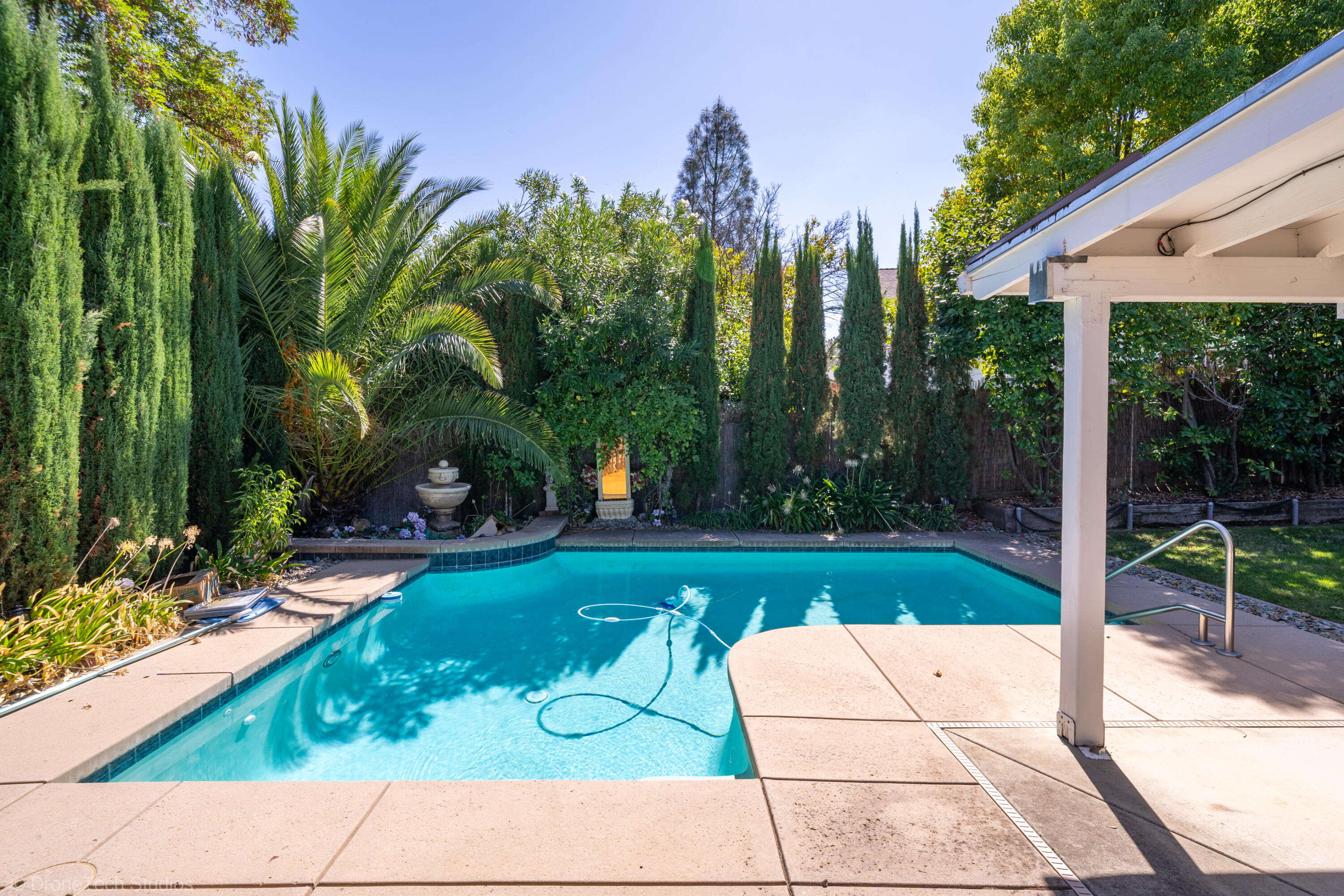 2227 Wicklow Street Redding, CA 96001 - Photo 39 of 90 a view of backyard with plants and outdoor seating