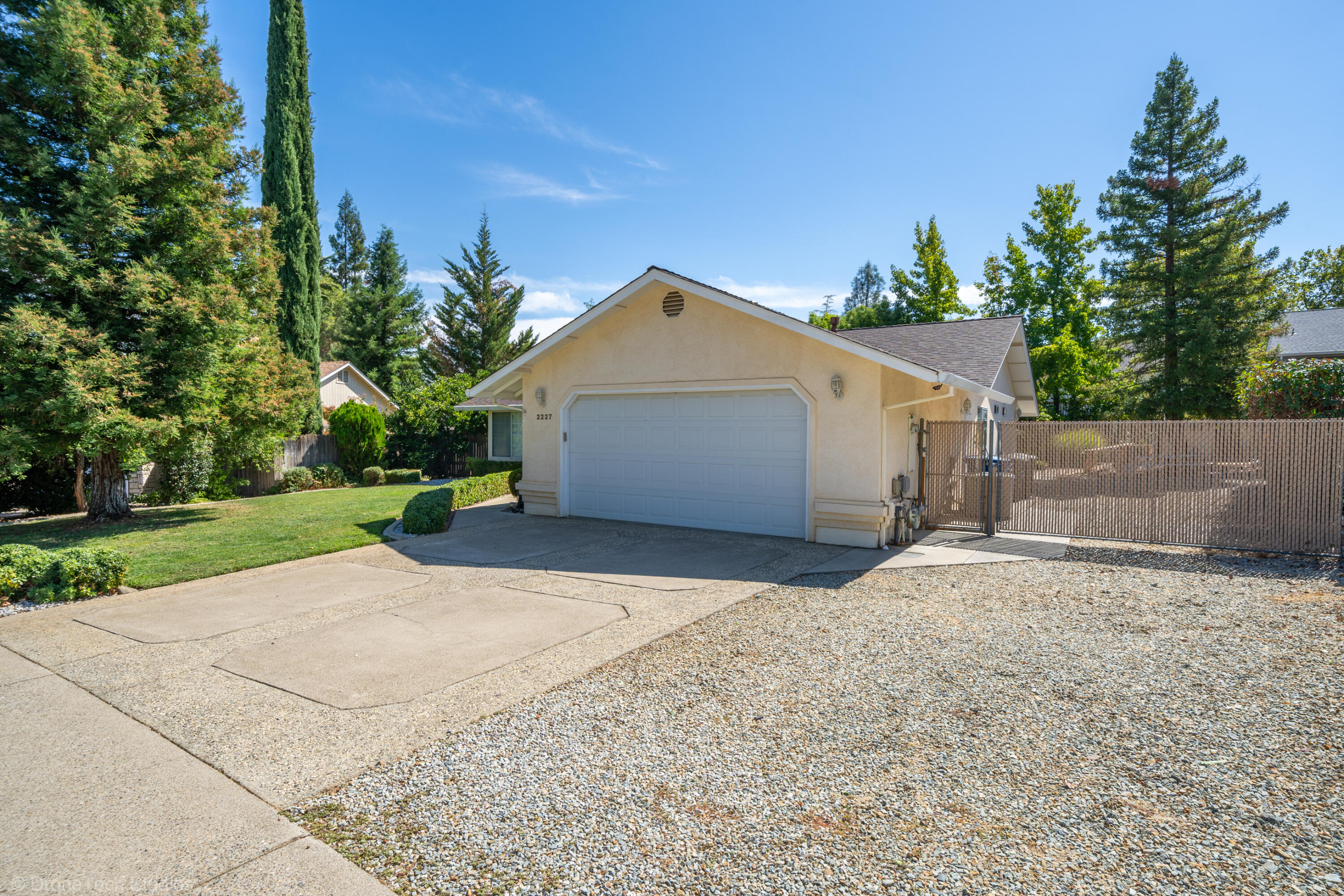 2227 Wicklow Street Redding, CA 96001 - Photo 4 of 90 a front view of a house with a yard and garage